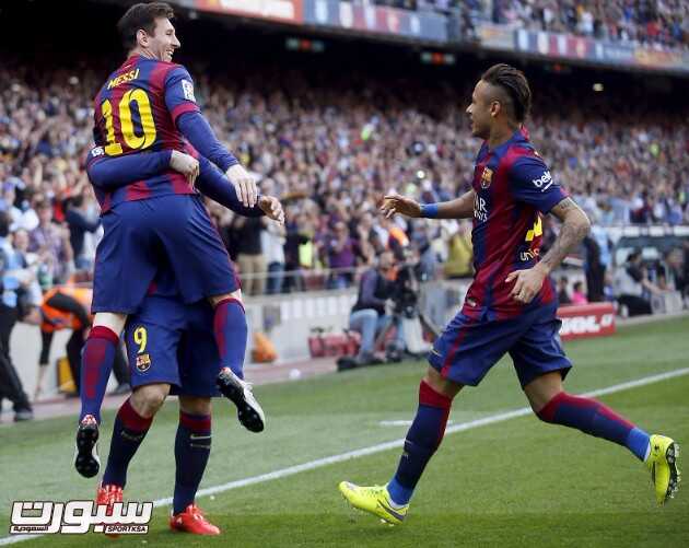 Barcelona's Lionel Messi, Luis Suarez and Neymar celebrate a goal against Valencia during their Spanish first division soccer match at Camp Nou stadium in Barcelona