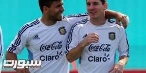 Argentina's national football forward Lionel Messi (R) talks with teammate forward Sergio Aguero during a training session in Ezeiza, Buenos Aires, on September 6, 2013. Argentina will face Paraguay on September 10 in Asuncion in a Brazil 2014 FIFA World Cup South American qualifier match.   AFP PHOTO / DANIEL GARCIA        (Photo credit should read DANIEL GARCIA/AFP/Getty Images)