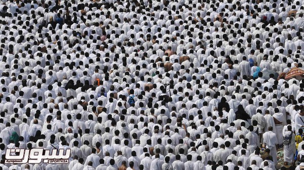 Muslim pilgrims perform Friday prayers around Namirah mosque on the plains of Arafat during the annual haj pilgrimage, outside the holy city of Mecca