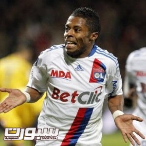 Lyon's Michel Bastos, of Brazil, celebrates after scoring against Sochaux during their French League One soccer match at Gerland stadium, in Lyon, central France, Saturday, Oct. 30, 2010. (AP Photo/Laurent Cipriani)
