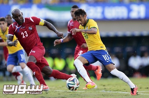 Neymar of Brazil challenges Baloy of Panama during an international friendly soccer match, in Goiania